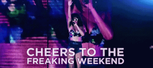 a woman in a bikini singing into a microphone with the words cheers to the freaking weekend above her .