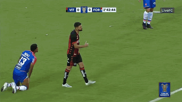 a soccer player with the number 13 on his back