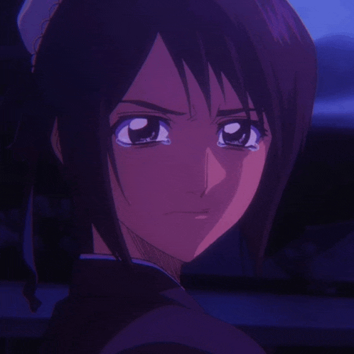 a close up of a girl 's face with tears running down her face