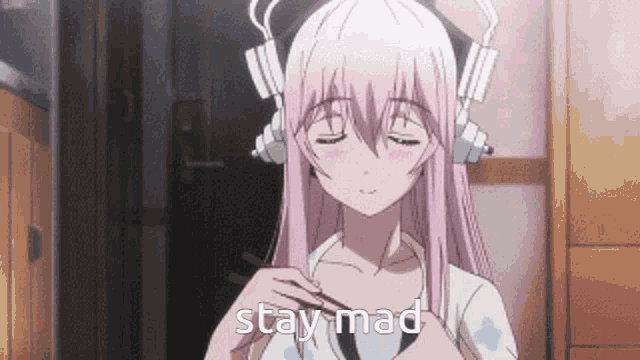 a girl with pink hair and headphones is holding chopsticks and saying stay mad