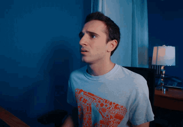 a man wearing a t-shirt that says ' i 'm sorry ' on it