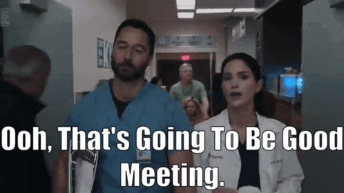 a man and a woman in scrubs are walking down a hallway with the words " that 's going to be good meeting