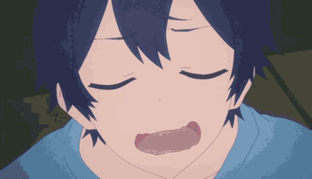 a person with their eyes closed and their mouth open