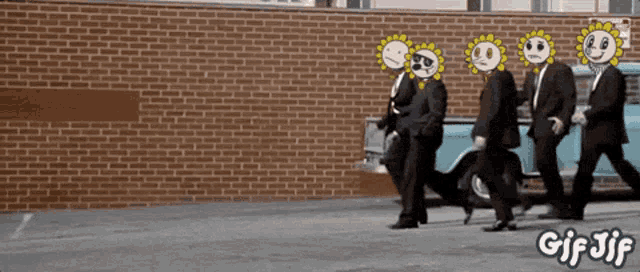 a group of men in suits with sunflowers on their faces are walking down a street