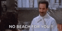 a man in a chef 's uniform is talking to a woman in a kitchen and says `` no beach for you ! ''