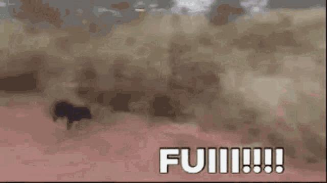 a person is running through a dust storm with the words full written on the bottom of the screen .