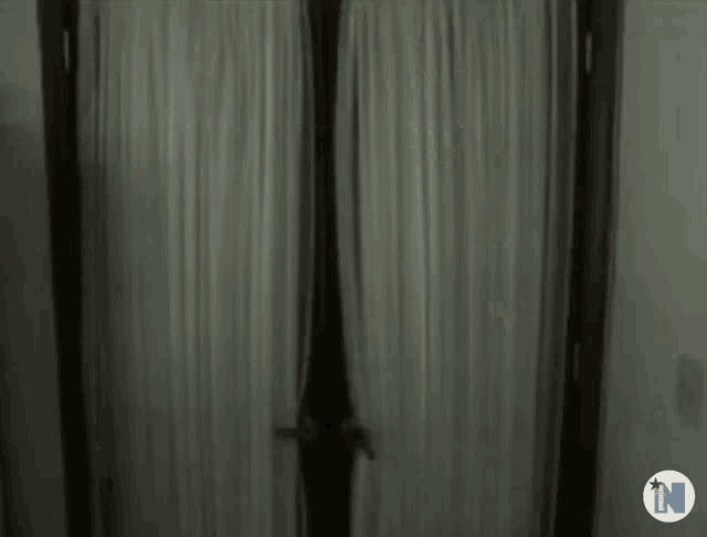 a dark room with the letter n on the bottom left