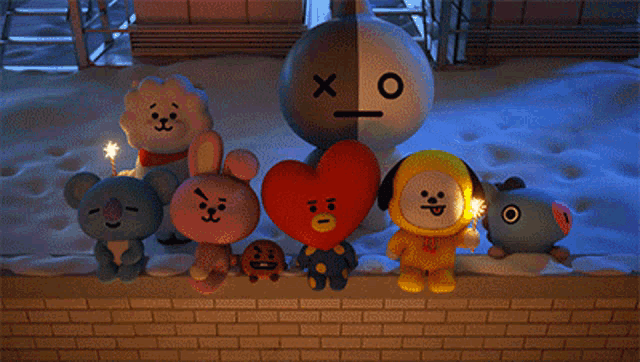 a group of stuffed animals are standing next to each other