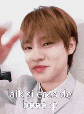 a young man in a suit and tie is making a funny face and says laik si eres de beee p