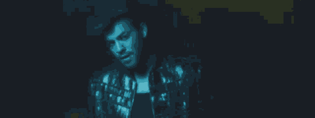 a pixelated image of a man with a beard and mustache