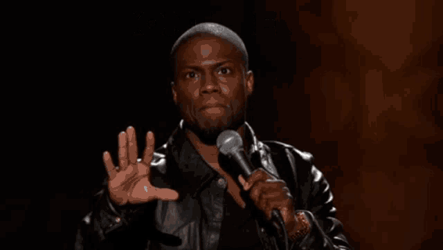 a man holding a microphone with the words " dont be a little bitch " on the bottom