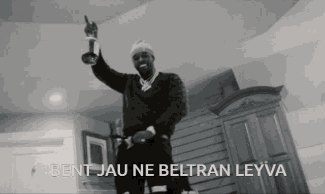 a black and white photo of a man with bent jau ne beltran leyva