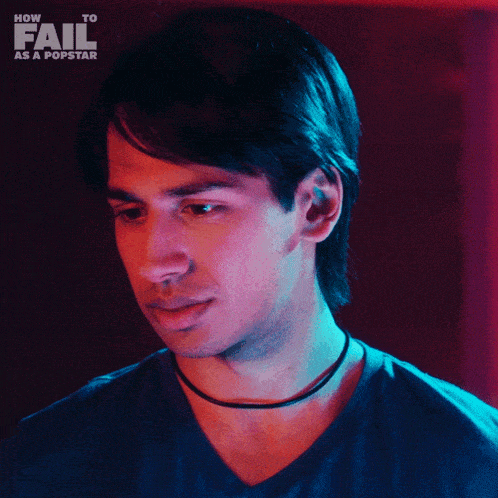 a man 's face is shown with the words how to fail as a popstar behind him