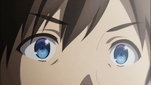 a close up of a person 's eyes with a blue pupil