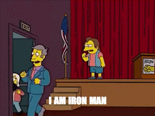 a cartoon of a man standing on a stage with the words " i am iron man " above him