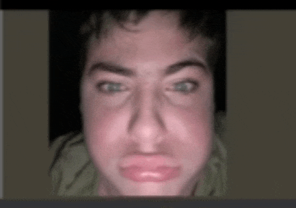 a close up of a person 's face making a silly face