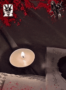 a candle sits on a table next to a book that says dvasa on it