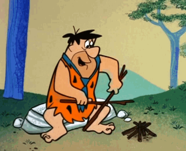 flintstone from the flintstones is sitting on a rock holding a stick