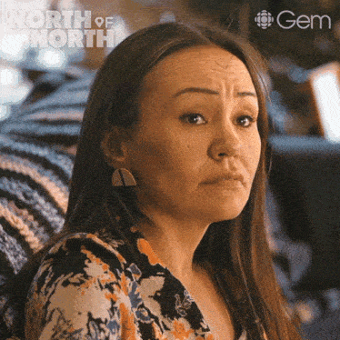 a close up of a woman 's face with the word north of north behind her