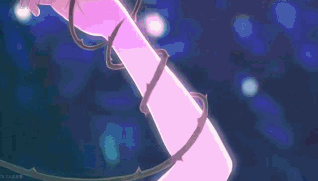 a close up of a person 's arm with a purple rope around it