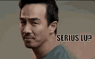 a man with a beard is looking at the camera with the words `` serious lu ? '' written on the bottom .
