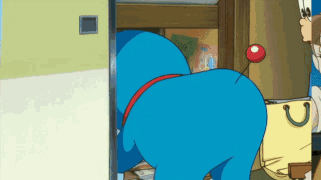 a blue cartoon character is standing in a room
