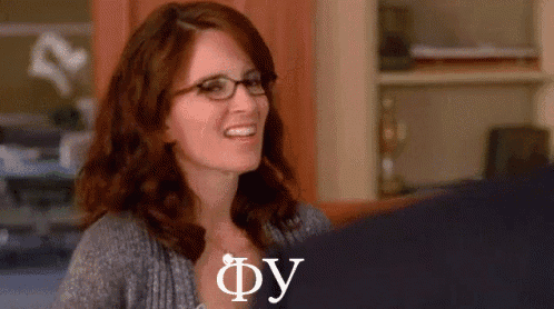 a woman wearing glasses is smiling and the word fy is visible
