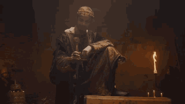 a man with a crown on his head sits in front of a chest