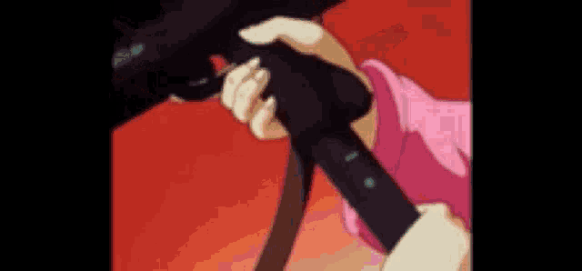 a close up of a person holding a gun in their hands .