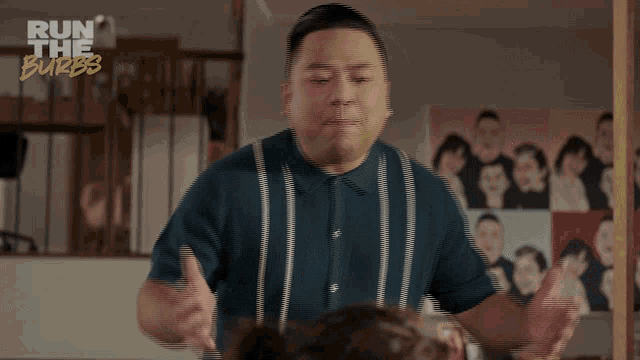 a man in a blue and white striped shirt says baybayyyy