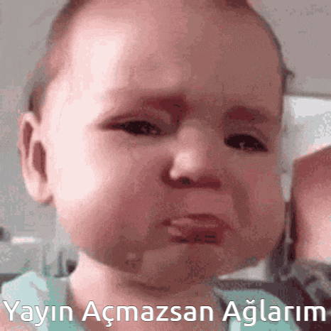 a baby is making a sad face with the words " yayin acmazsan aglarim " written below it