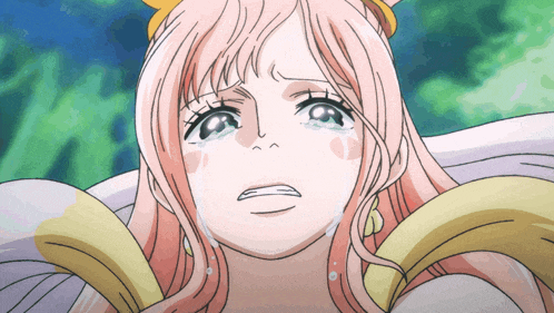 a girl with pink hair is crying and has tears running down her face