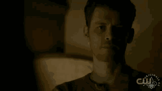 a close up of a man 's face with the words originals on the bottom left