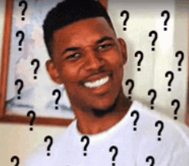 a man is smiling with a lot of question marks around his face