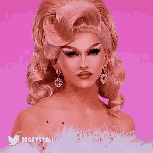 a woman with a wig and earrings has the hashtag tecrystali below her