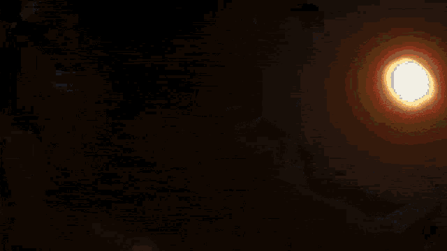 a bright light is shining in the dark