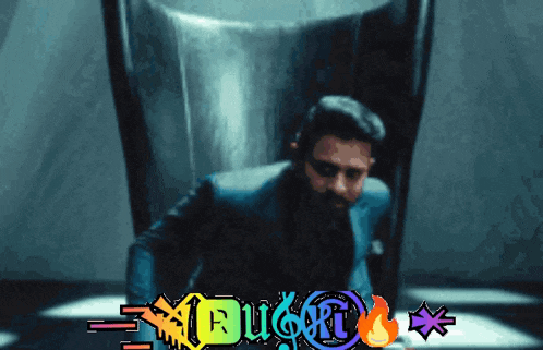 a man in a suit is sitting in a chair with the word feuer written on the bottom
