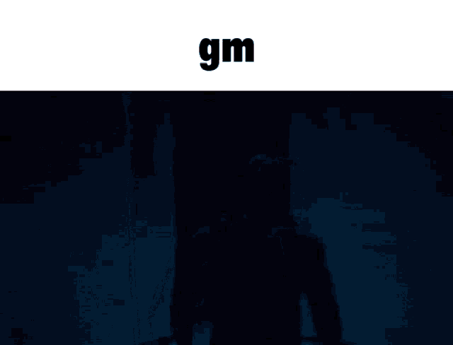 a man is walking through a dark room and the word gm is above him