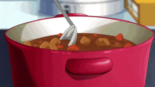 a pot of curry with a fork in it