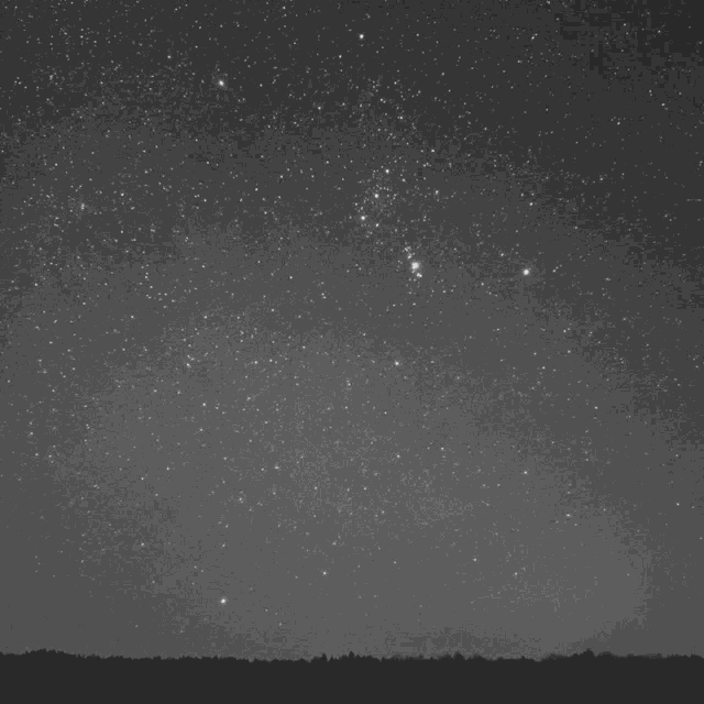 a black and white photo of a starry night sky with the word bui in white letters