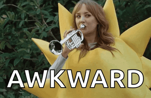 a woman in a sun costume is playing a trumpet and the word awkward is on the bottom right