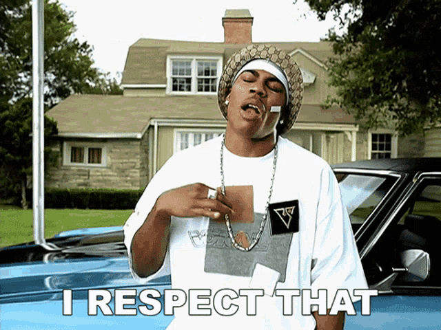 a man standing in front of a car with the words " i respect that " above him