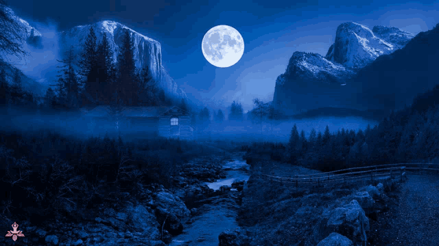 a full moon shines over a mountain range