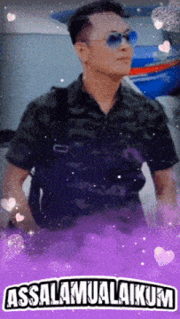 a man wearing sunglasses and a camouflage shirt is surrounded by purple hearts and the words assalamualaikum