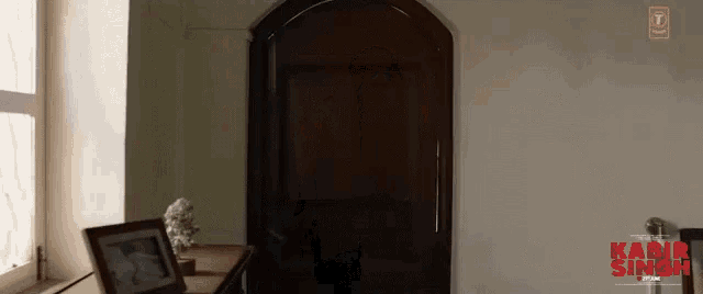 a poster for a movie called kabir singh shows a doorway