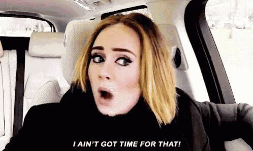 a woman is sitting in a car with her mouth open and says i ain 't got time for that