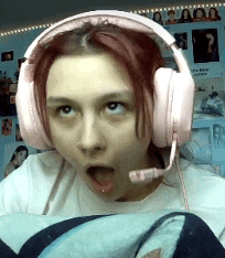 a girl wearing pink headphones with a microphone on her head