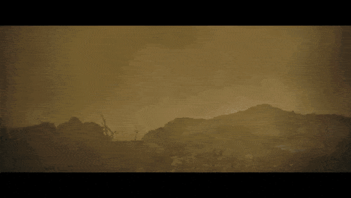 a dark background with a few spots of light visible