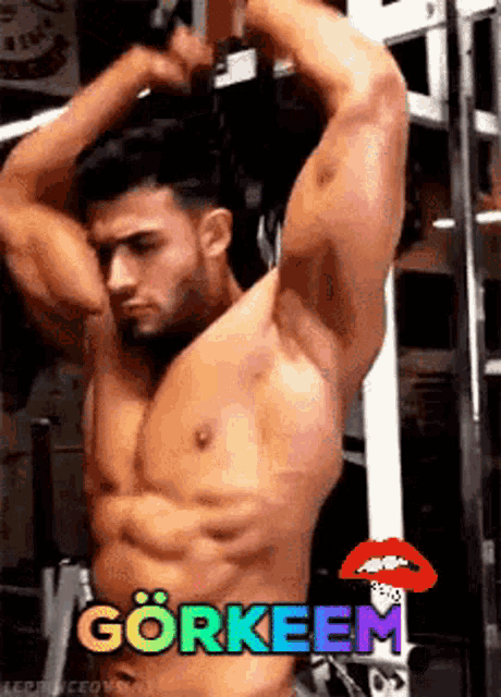 a shirtless man is doing exercises in a gym with the words gorkeem written on the bottom