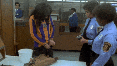 a woman is being searched by a security guard